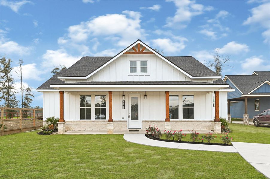 Front exterior of a new home in , Huffman, TX, highlighting curb appeal (Image 1). Front exterior of a new home in , Huffman, TX, highlighting curb appeal (Image 1).