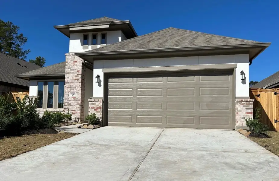 Front exterior of a new home in The Highlands 45', Porter, TX, highlighting curb appeal (Image 2).