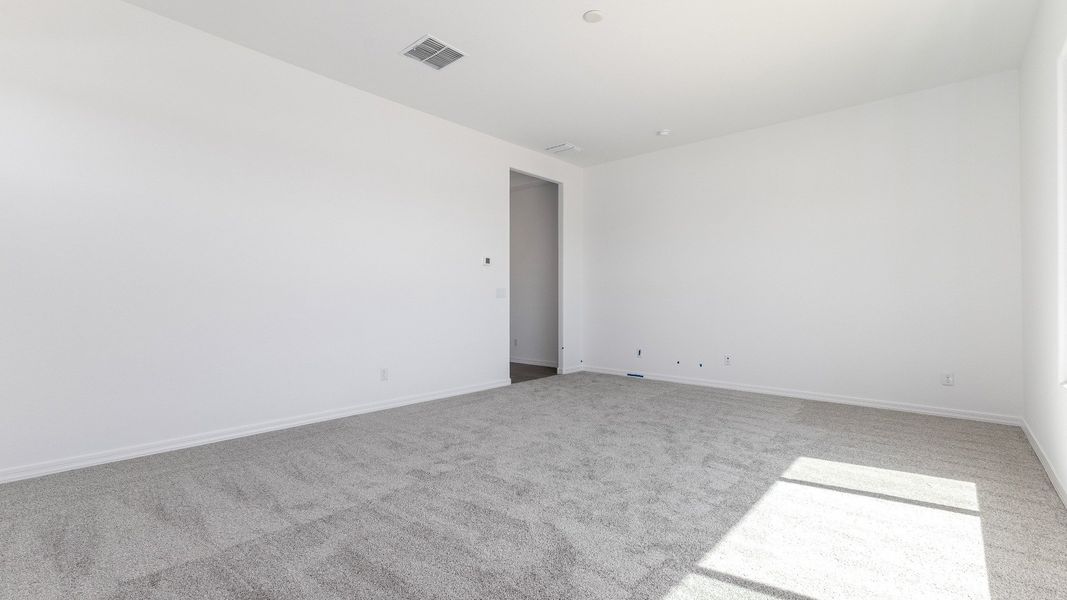 Representative furnished interior of a home built from the Granada by DRB Homes in Windrose, Waddell (Image 25).