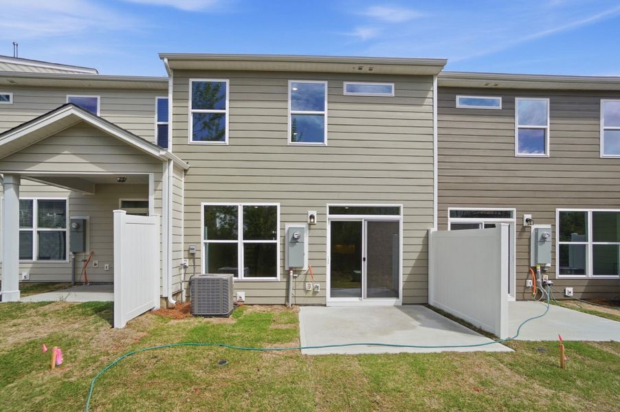 Exterior details and patio area of a home in Harrisburg Village Townhomes, Harrisburg (Image 28).