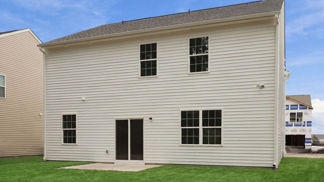 Exterior details and patio area of a home in Ridgewood Farms, Winterville (Image 18).
