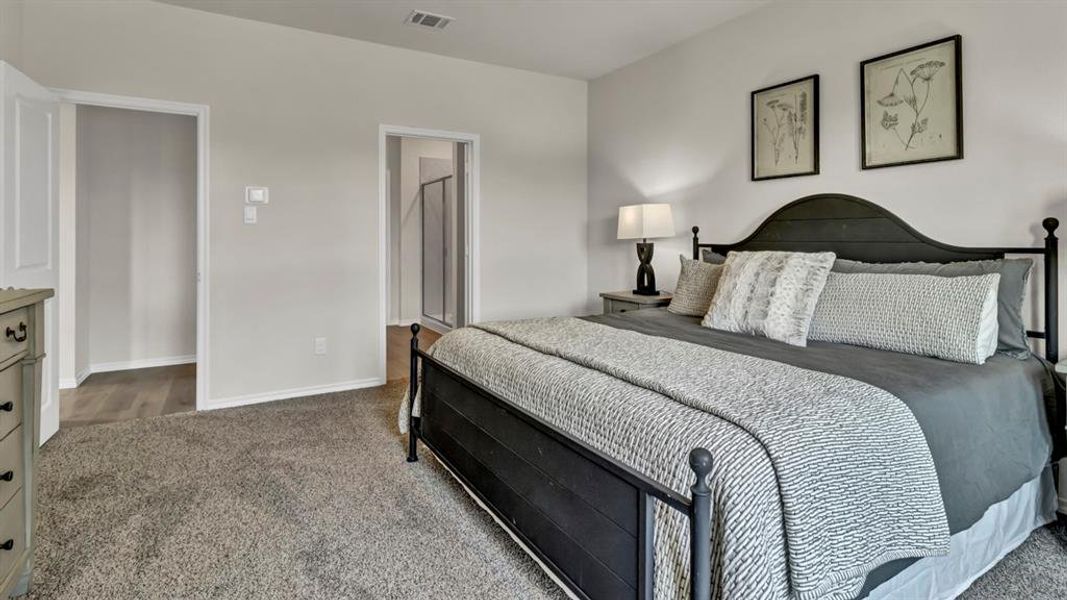 Carpeted bedroom featuring light-toned walls and white trim Carpeted bedroom featuring light-toned walls and white trim