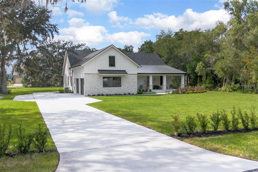 Front exterior of a new home in , Deland, FL, highlighting curb appeal (Image 28).