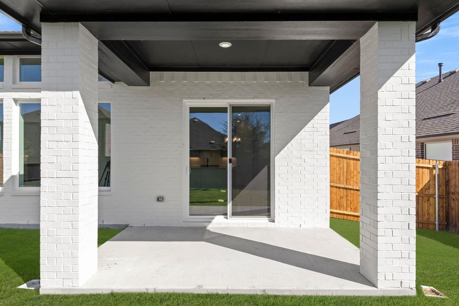 Exterior details and patio area of a home in West Crossing, Anna (Image 3).