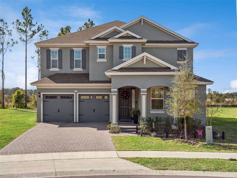 Front exterior of a new home in Talichet, Howey-in-the-Hills, FL, highlighting curb appeal (Image 2). Front exterior of a new home in Talichet, Howey-in-the-Hills, FL, highlighting curb appeal (Image 2).