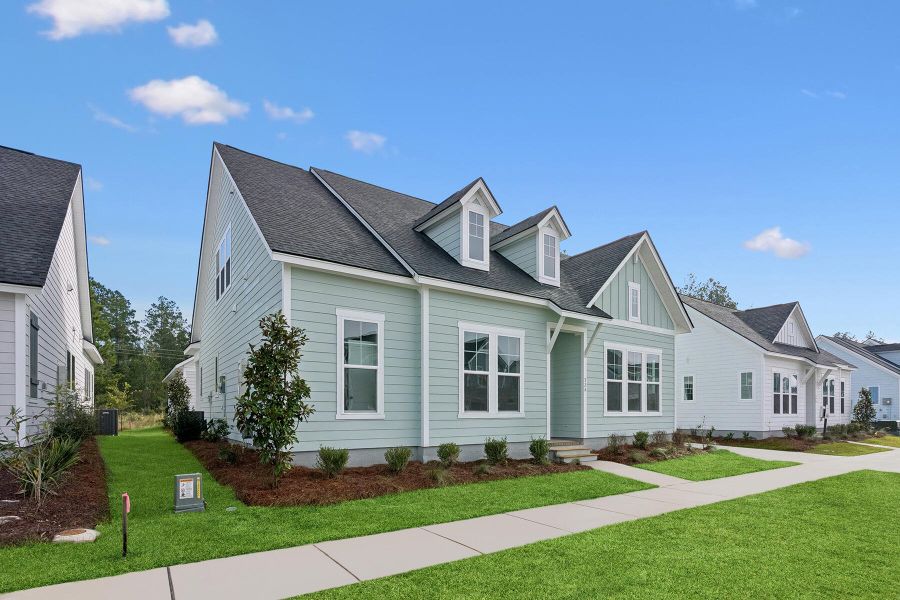 Front exterior of a new home in Nexton – Midtown – The Garden Collection, Summerville, SC, highlighting curb appeal (Image 20). Front exterior of a new home in Nexton – Midtown – The Garden Collection, Summerville, SC, highlighting curb appeal (Image 20).