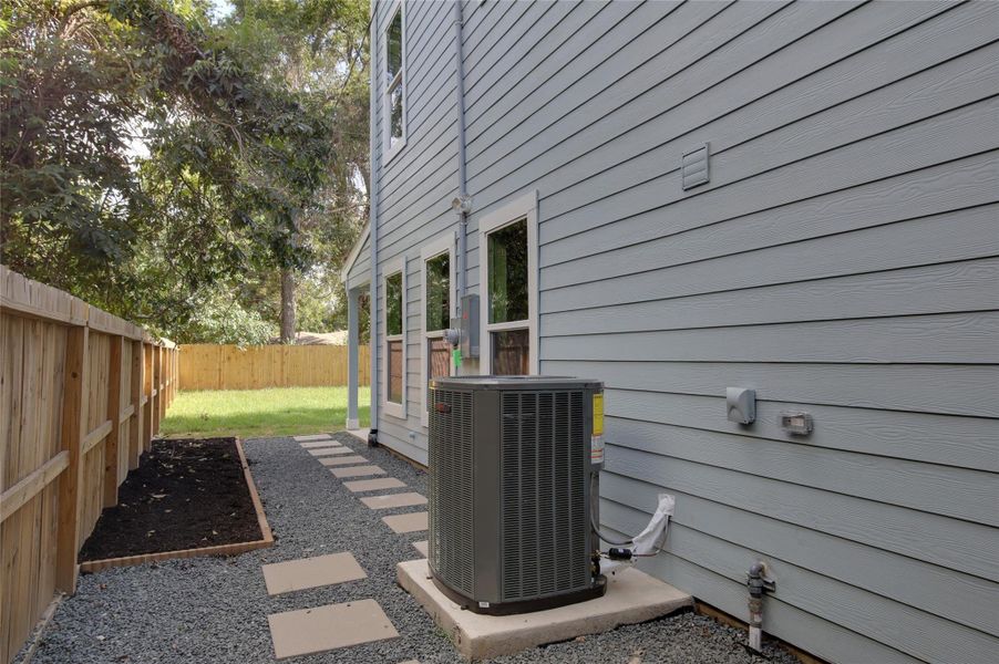 Low-maintenance side yard with paver walkwayand gravel border for easy drainage. Fresh mulchbed ready for planting, exterior lighting, and easyaccess to the covered patio and grassy backyard.Fully fenced for privacy. Top quality Trane HVACequipment. Low-maintenance side yard with paver walkwayand gravel border for easy drainage. Fresh mulchbed ready for planting, exterior lighting, and easyaccess to the covered patio and grassy backyard.Fully fenced for privacy. Top quality Trane HVACequipment.
