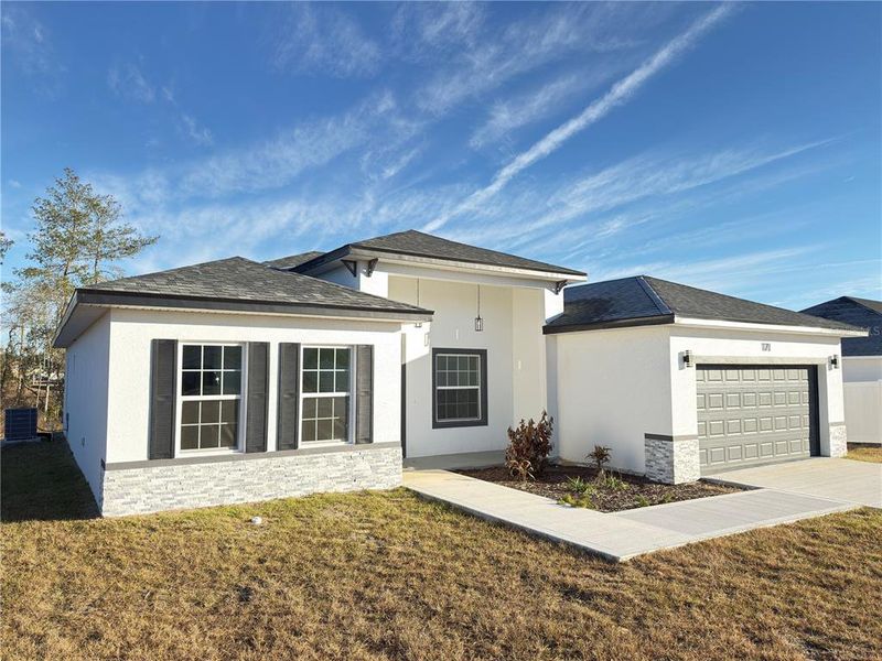Front exterior of a new home in , Ocala, FL, highlighting curb appeal (Image 25).