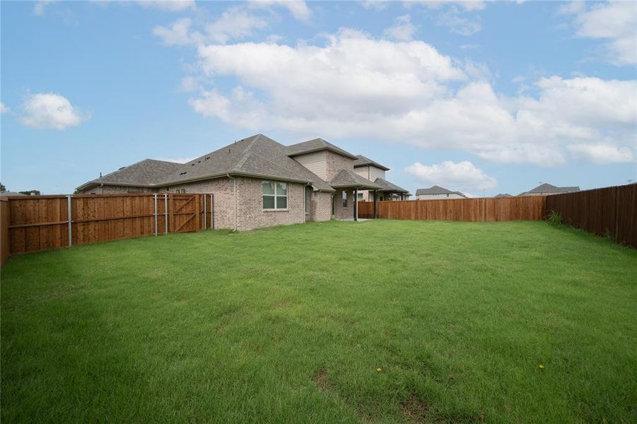 Front exterior of a new home in Brookville Estates: Brookville, Forney, TX, highlighting curb appeal (Image 1). Front exterior of a new home in Brookville Estates: Brookville, Forney, TX, highlighting curb appeal (Image 1).