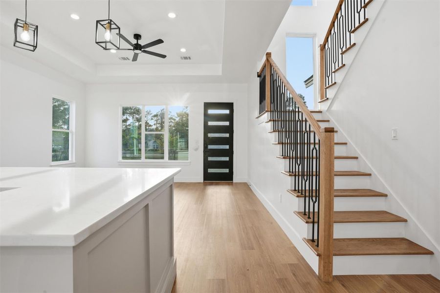 Foyer entrance featuring light wood-style floors, a ceiling fan, and recessed lighting
