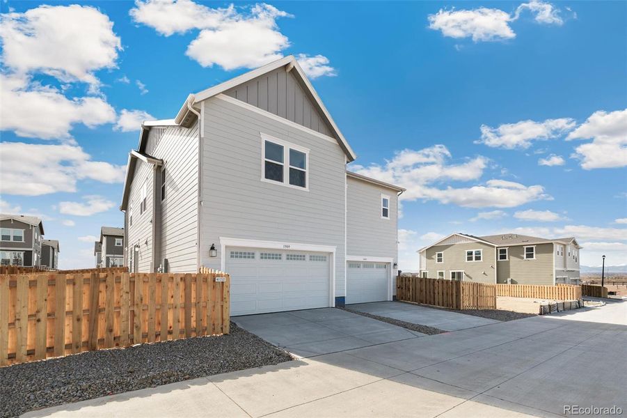 Front exterior of a new home in Turnberry Villas, Commerce City, CO, highlighting curb appeal (Image 23).