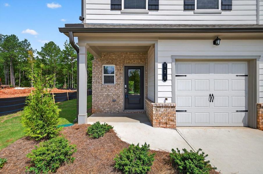 Front exterior of a new home in Fernhurst, McDonough, GA, highlighting curb appeal (Image 21).