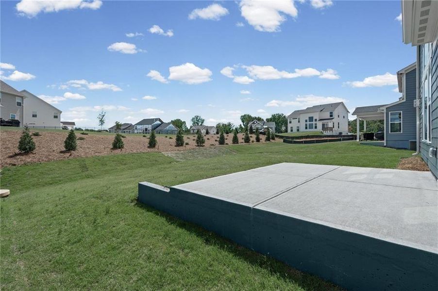Exterior details and patio area of a home in Twin Lakes, Hoschton (Image 23).