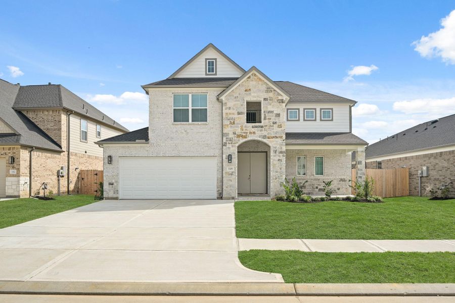 Front exterior of a new home in Barton Creek Ranch, Conroe, TX, highlighting curb appeal (Image 2). Front exterior of a new home in Barton Creek Ranch, Conroe, TX, highlighting curb appeal (Image 2).