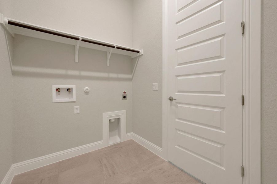 Laundry area with hookup for a gas dryer, electric dryer hookup, and hookup for a washing machine Laundry area with hookup for a gas dryer, electric dryer hookup, and hookup for a washing machine