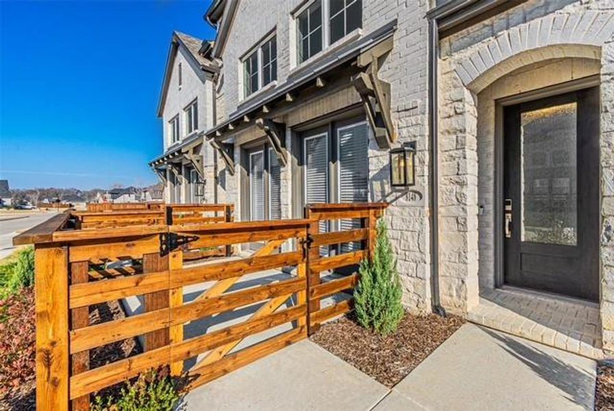 Entrance to property featuring stone siding