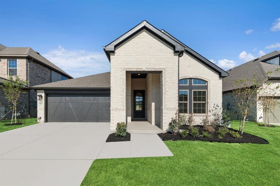 Exterior details and patio area of a home in South Pointe  Cottage Series, Mansfield (Image 1).