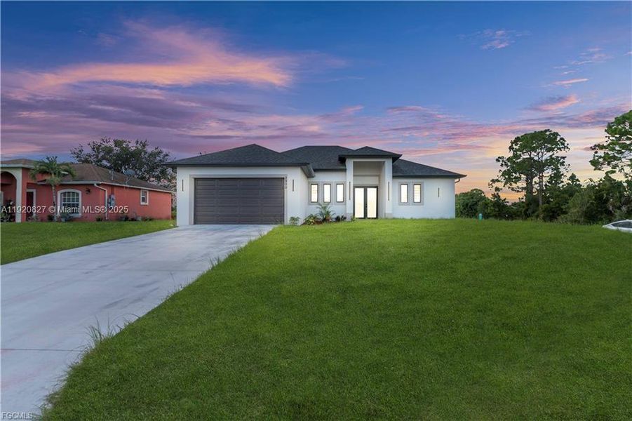 Front exterior of a new home in , Lehigh Acres, FL, highlighting curb appeal (Image 22). Front exterior of a new home in , Lehigh Acres, FL, highlighting curb appeal (Image 22).