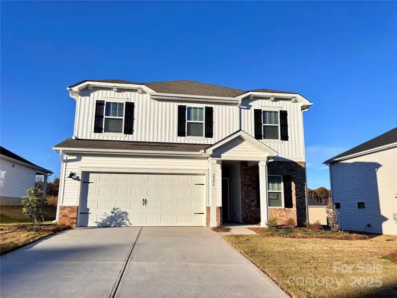Front exterior of a new home in Harper Landing, Stanley, NC, highlighting curb appeal (Image 1).
