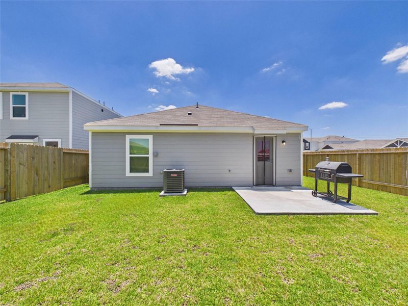 Exterior details and patio area of a home in Park Vista at El Tesoro, Houston (Image 27).