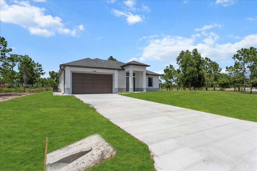 Front exterior of a new home in , Labelle, FL, highlighting curb appeal (Image 16). Front exterior of a new home in , Labelle, FL, highlighting curb appeal (Image 16).