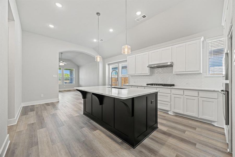 KITCHEN WITH ISLAND, UNDER MOUNT SINK AND UPGRADED FAUCET KITCHEN WITH ISLAND, UNDER MOUNT SINK AND UPGRADED FAUCET