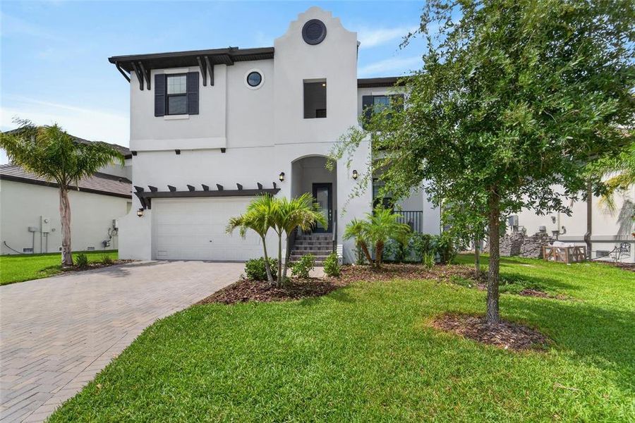 Front exterior of a new home in SouthShore Yacht Club, Ruskin, FL, highlighting curb appeal (Image 27).