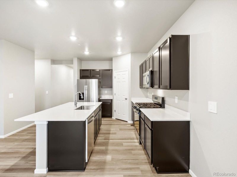 Furnished interior view inside a new home in Buffalo Highlands: The Flora Collection, Commerce City (Image 12). Furnished interior view inside a new home in Buffalo Highlands: The Flora Collection, Commerce City (Image 12).