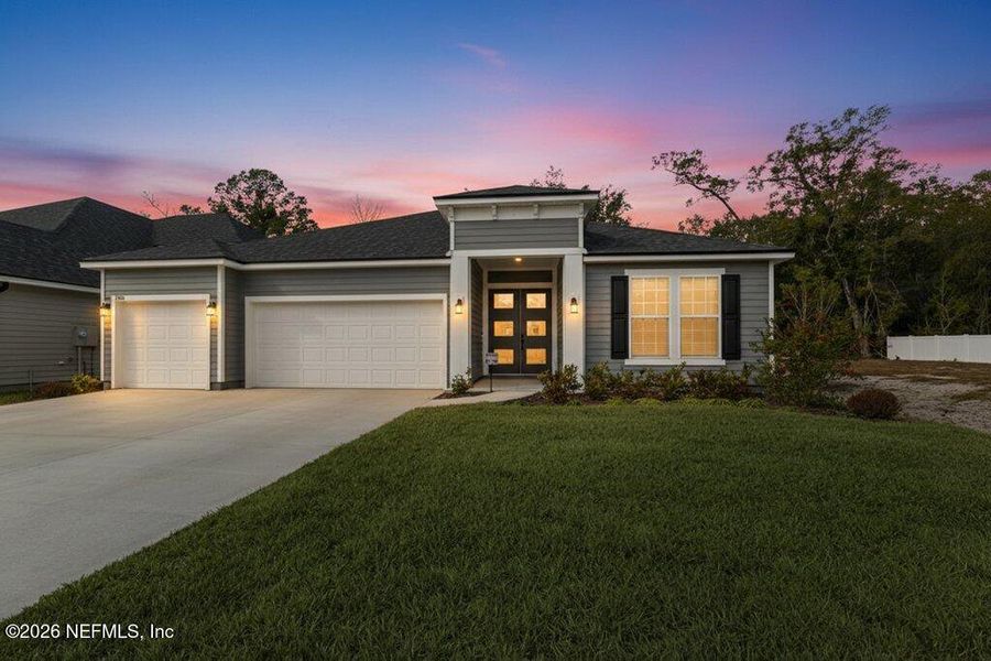 Front exterior of a new home in , Middleburg, FL, highlighting curb appeal (Image 24).