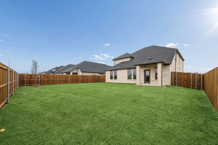 Covered Patio in the Masters home plan by Trophy Signature Homes – REPRESENTATIVE PHOTO