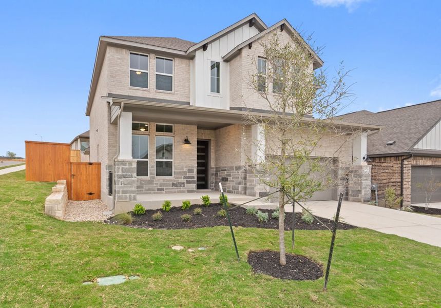 Front exterior of a new home in Park Collection at Lariat, Liberty Hill, TX, highlighting curb appeal (Image 26).