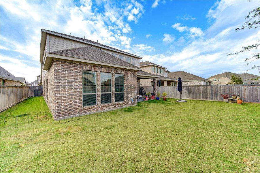 Spacious yard perfect for alfresco dining, relaxation, and recreation.