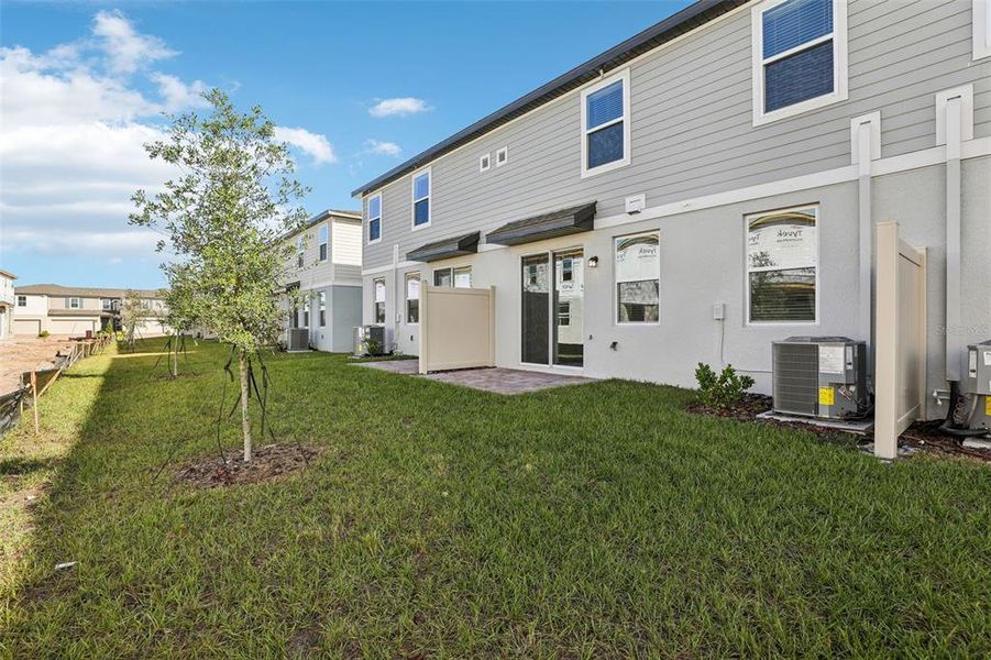 Exterior details and patio area of a home in The Meadow at Crossprairie Bungalows, St. Cloud (Image 37).