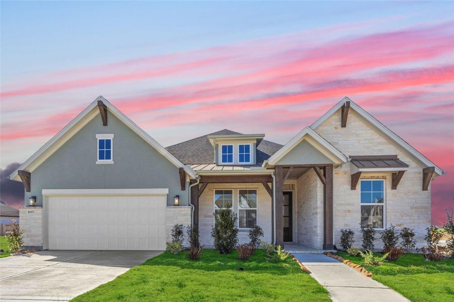 Front exterior of a new home in Valencia, Manvel, TX, highlighting curb appeal (Image 2).