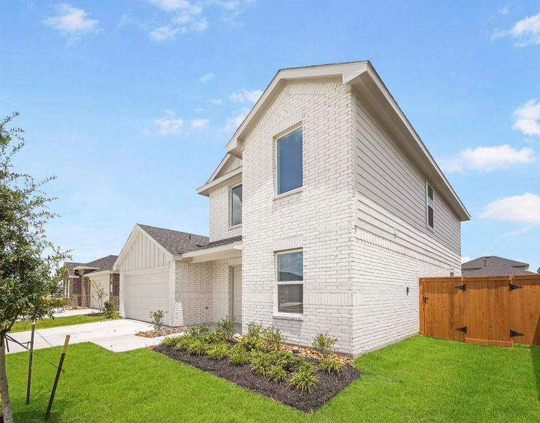 Front exterior of a new home in Cypress Green, Hockley, TX, highlighting curb appeal (Image 15).