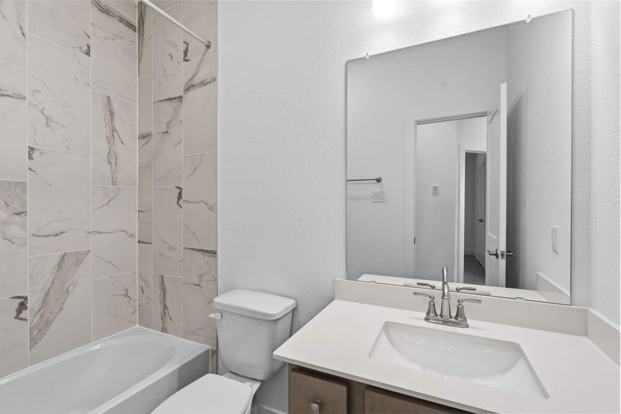 Furnished interior view inside a new home in Meridiana, Manvel (Image 9).