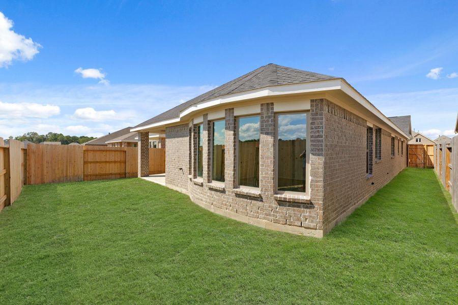 Exterior details and patio area of a home in The Trails, New Caney (Image 23). Exterior details and patio area of a home in The Trails, New Caney (Image 23).