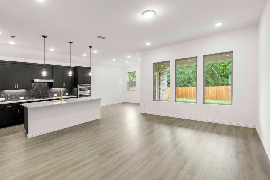 Open Kitchen-Living-Dining Room Representative Photo featuring the Noir Collection
