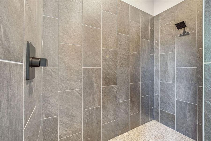 Bathroom featuring a tile shower