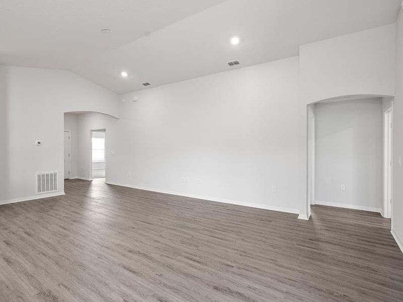 Enjoy a sunny, open living area with volume ceilings - Remy by Highland Homes Enjoy a sunny, open living area with volume ceilings - Remy by Highland Homes