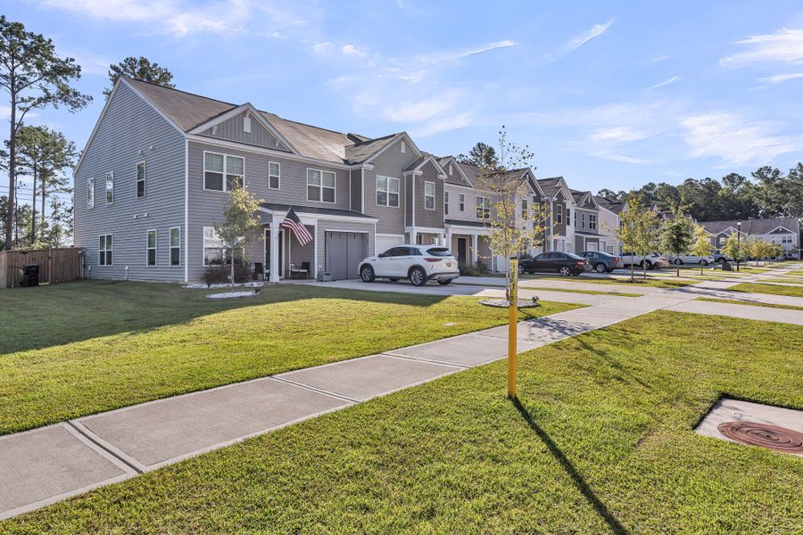 Front exterior of a new home in , Summerville, SC, highlighting curb appeal (Image 18).