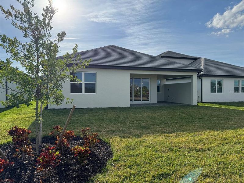 Exterior details and patio area of a home in Vistera of Venice, Nokomis (Image 3).