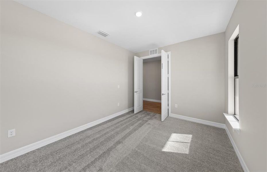 Spacious, unfurnished interior of a new home in The Strand at Cedar Grove, North Port (Image 35).