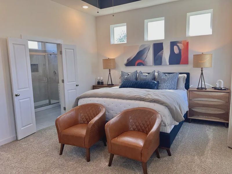 Representative furnished interior of a home built from the Saxony by Chesmar Homes in Sunterra, Katy (Image 7).