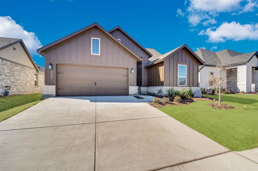 Front exterior of a new home in Hickory Hill, Sherman, TX, highlighting curb appeal (Image 2). Front exterior of a new home in Hickory Hill, Sherman, TX, highlighting curb appeal (Image 2).