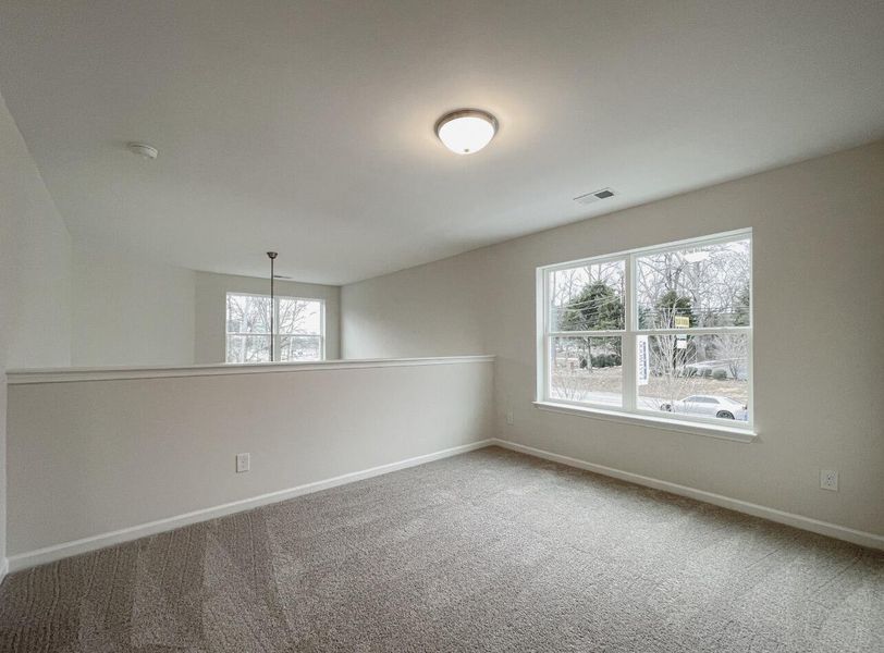 Spacious, unfurnished interior of a new home in East Main Townes, Spartanburg (Image 17).