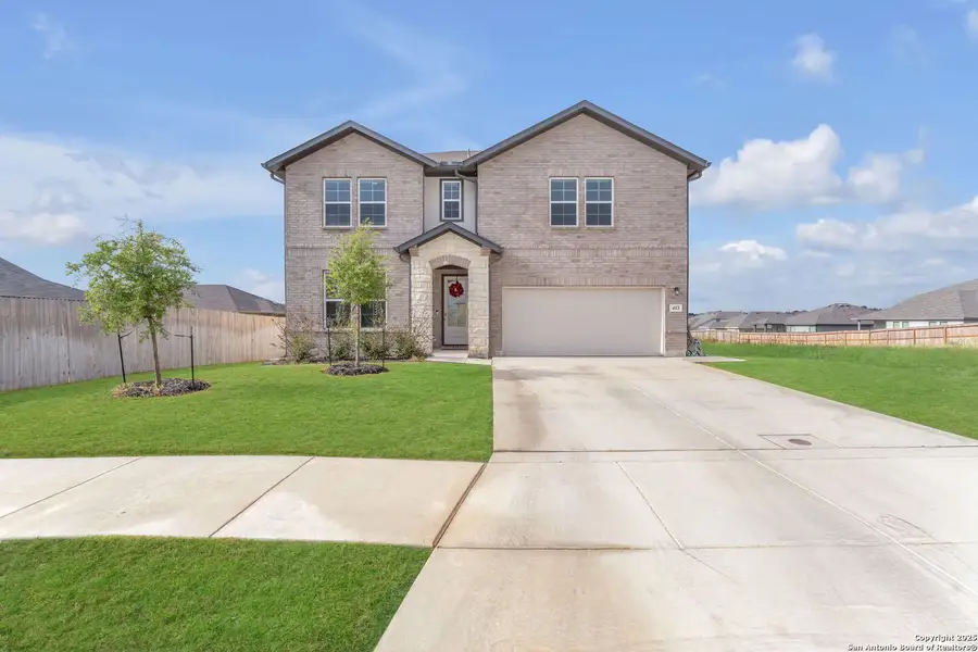 Front exterior of a new home in Saddle Creek Ranch, Cibolo, TX, highlighting curb appeal (Image 2). Front exterior of a new home in Saddle Creek Ranch, Cibolo, TX, highlighting curb appeal (Image 2).