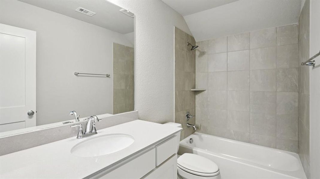 Full bath with a textured wall, shower / tub combination, and vanity Full bath with a textured wall, shower / tub combination, and vanity