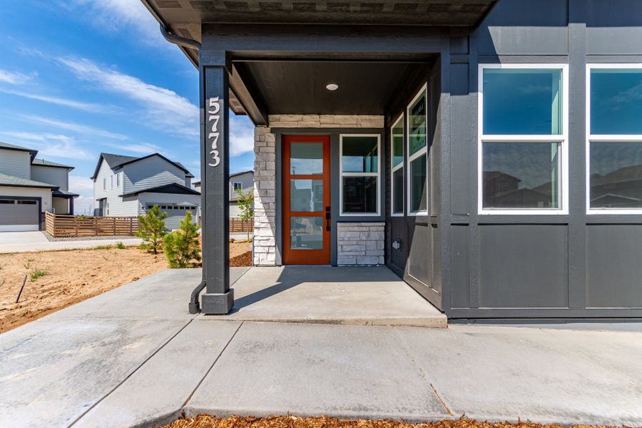 Front exterior of a new home in Painted Prairie, Aurora, CO, highlighting curb appeal (Image 19). Front exterior of a new home in Painted Prairie, Aurora, CO, highlighting curb appeal (Image 19).