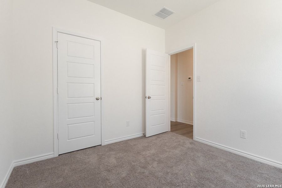 Spacious, unfurnished interior of a new home in Hidden Bluffs at TRP, San Antonio (Image 10).